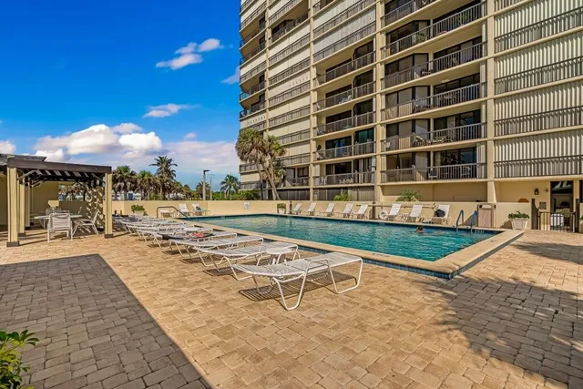 a view of a swimming pool with a lounge chairs