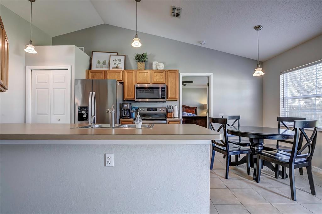 7325 Millstone Street Spring Hill, FL 34606 - Photo 26 of 46 Kitchen with Breakfast Nook
