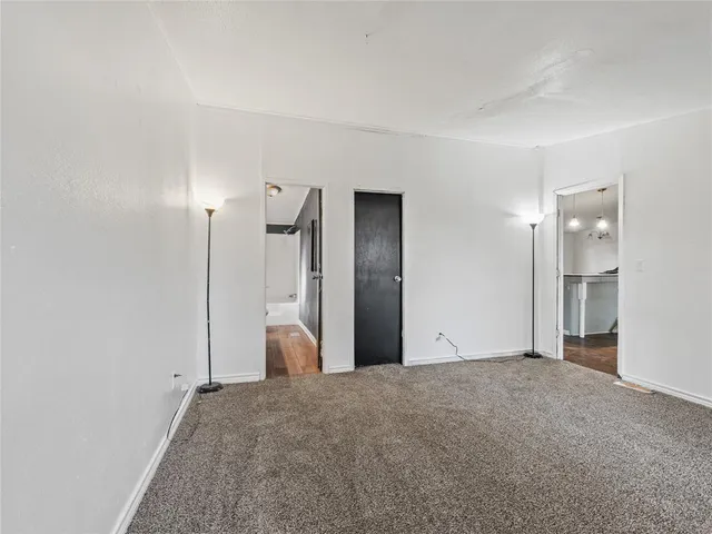 a view of a room with a sink and refrigerator