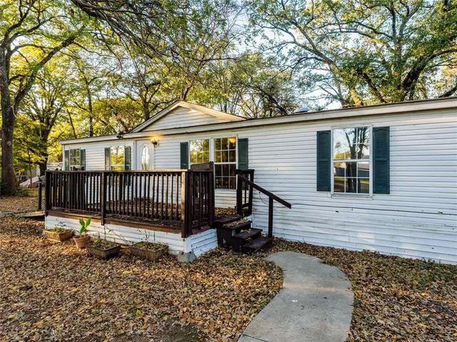 front view of a house with a bench