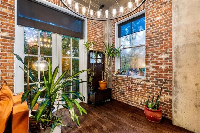 a view of front door of house with a potted plant
