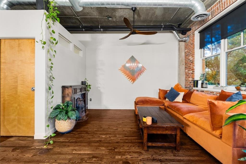 3235 Roswell Road Northeast, Unit 609 Atlanta, GA 30305 - Photo 15 of 30 a room with furniture and a potted plant