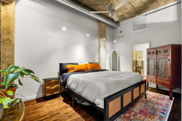 a bedroom with bed and a window