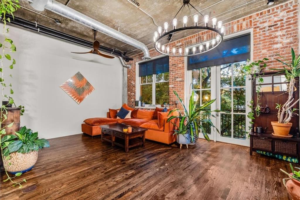 3235 Roswell Road Northeast, Unit 609 Atlanta, GA 30305 - Photo 2 of 30 a view of a chairs and table in a patio