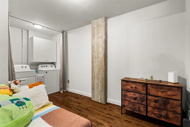 a bedroom with a bed and a dresser