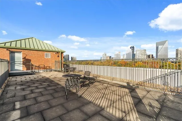 a view of balcony with furniture