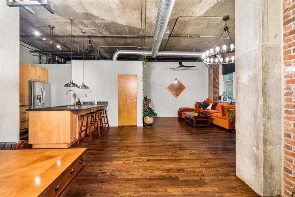 3235 Roswell Road Northeast, Unit 609 Atlanta, GA 30305 - Photo 5 of 30 a view of living room with furniture and a flat screen tv