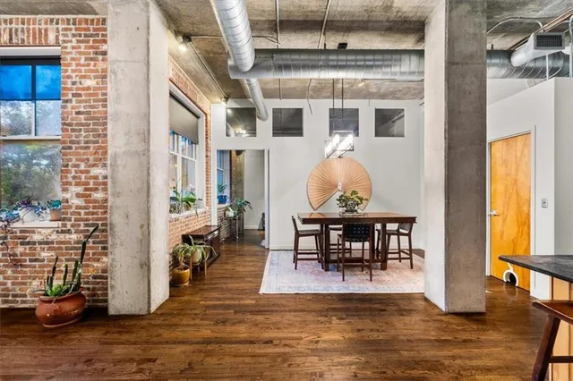 a view of a dining room with furniture window and wooden floor