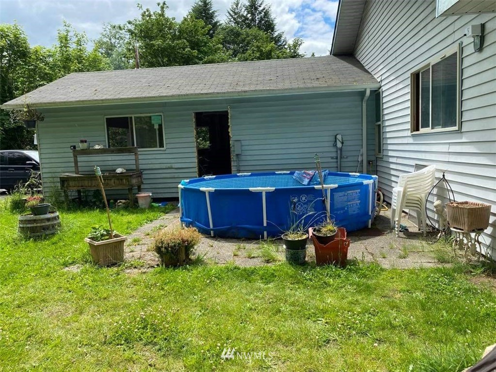 140 Kirkendall Road Toledo, WA 98591 - Photo 1 of 1 a backyard of a house with table and chairs
