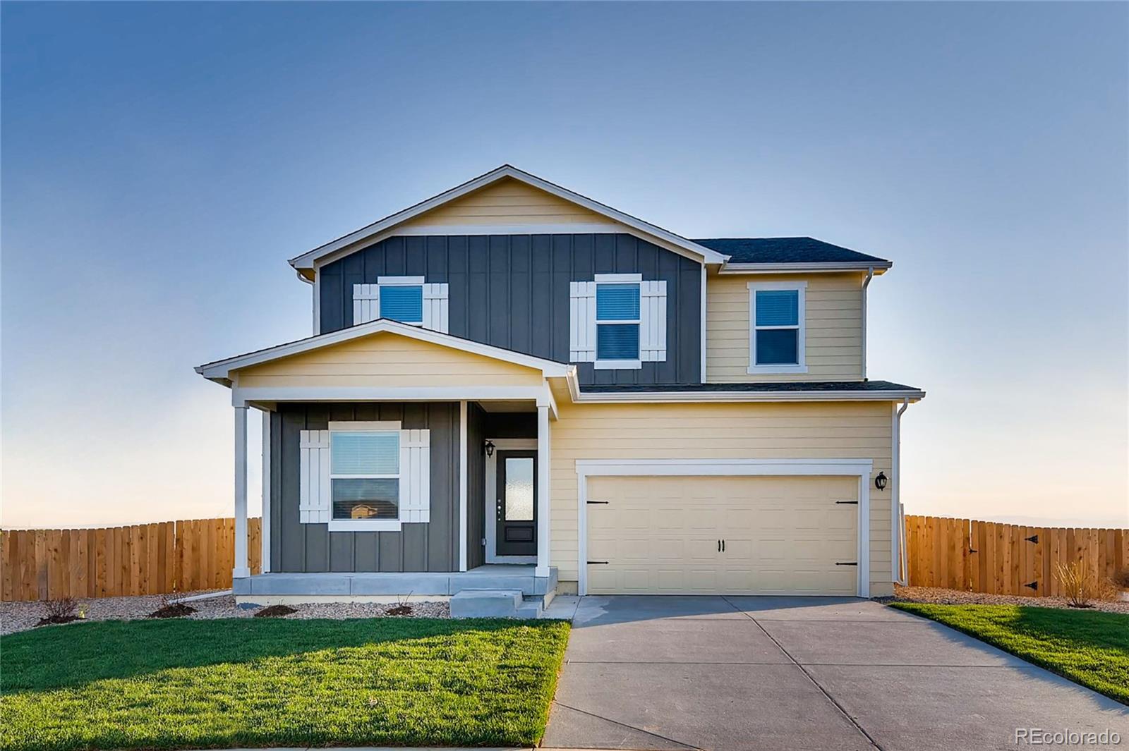 7132 Shavano Circle Frederick, CO 80504 - Photo 1 of 14 a front view of a house with a yard