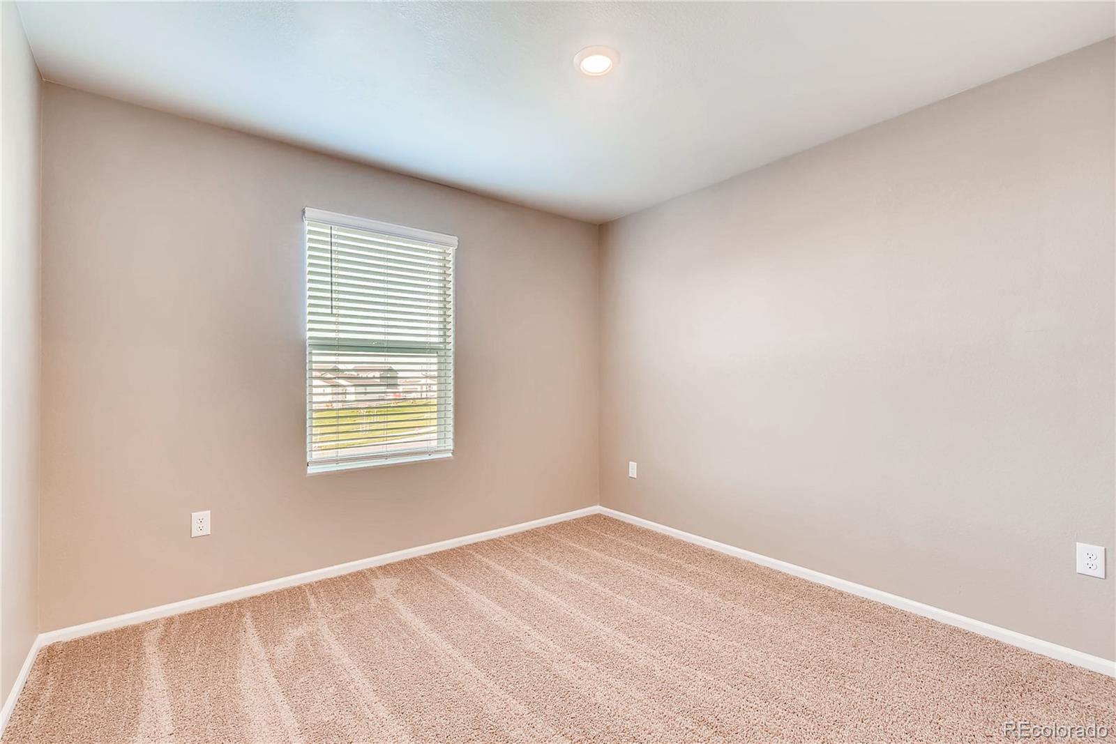 7132 Shavano Circle Frederick, CO 80504 - Photo 12 of 14 a view of an empty room with a window