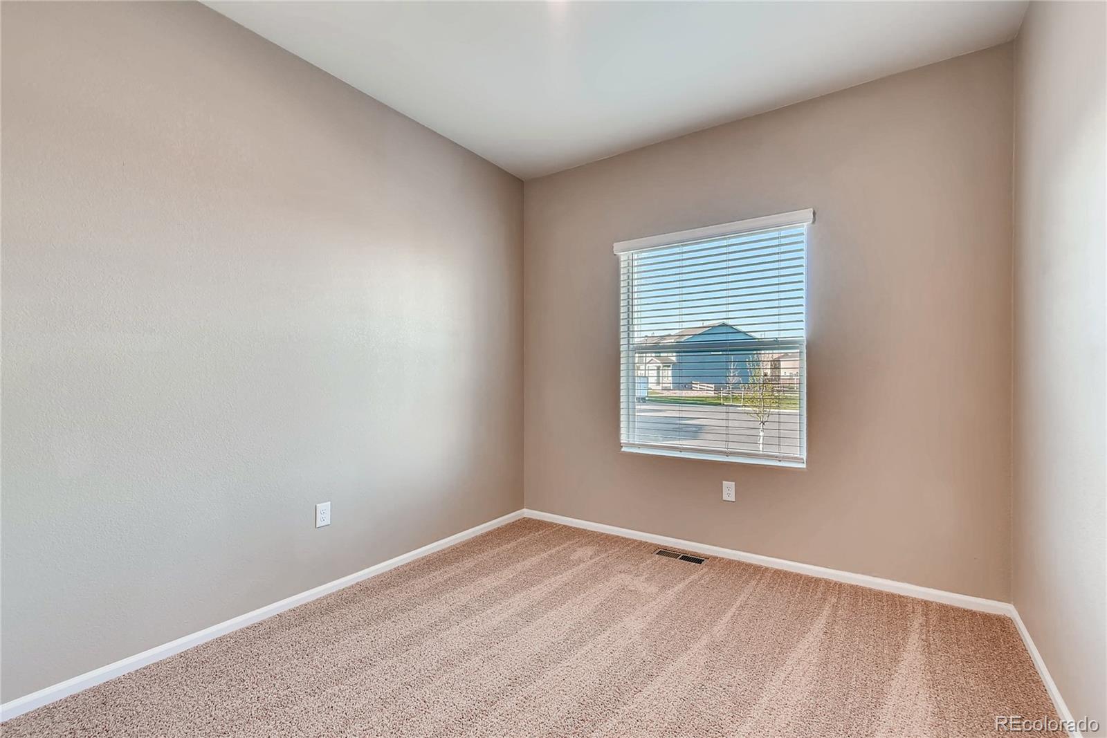 7132 Shavano Circle Frederick, CO 80504 - Photo 7 of 14 a view of an empty room with a window