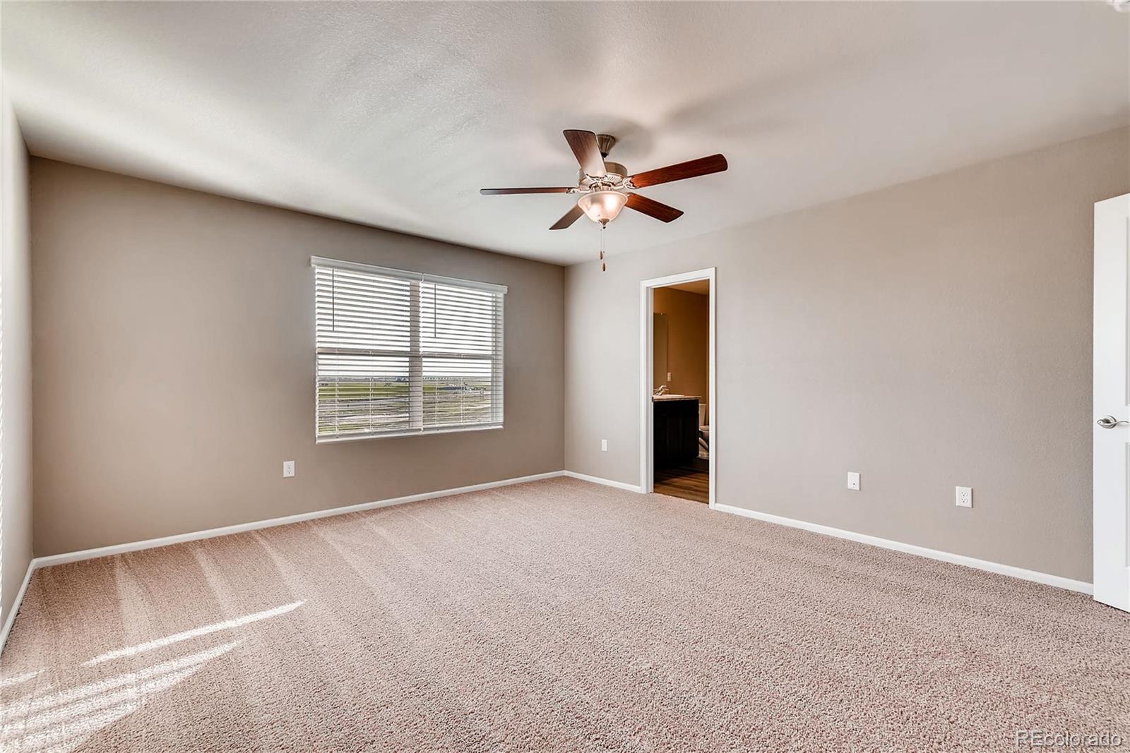 7132 Shavano Circle Frederick, CO 80504 - Photo 9 of 14 a view of room with a ceiling fan and window
