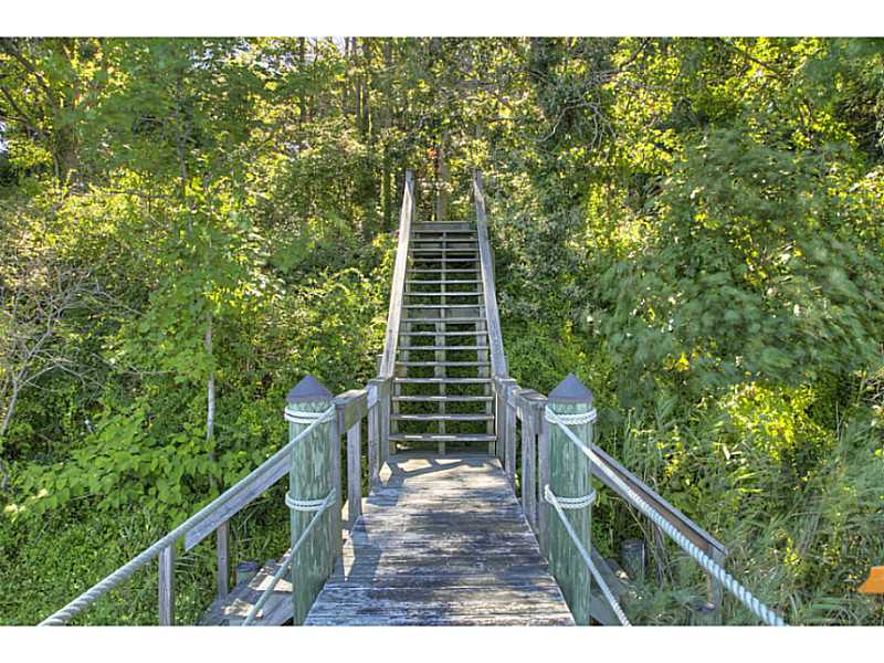 800 East Shore Road Jamestown, RI 02835 - Photo 9 of 21 Other. Stairs leading to dock. Seller has requested DEM approval for tree removal to create water view and increase open area. When approved, seller will clear appropriate portion of land.