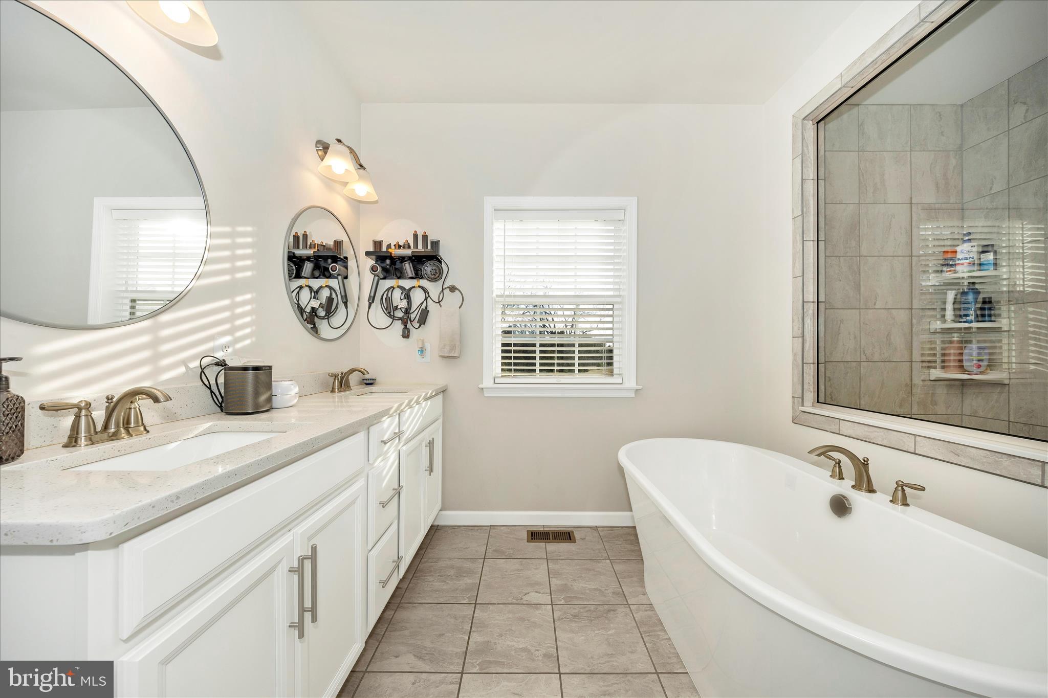 1600 Hobble Trail Frederick, MD 21702 - Photo 13 of 48 a bathroom with a double vanity sink and a mirror