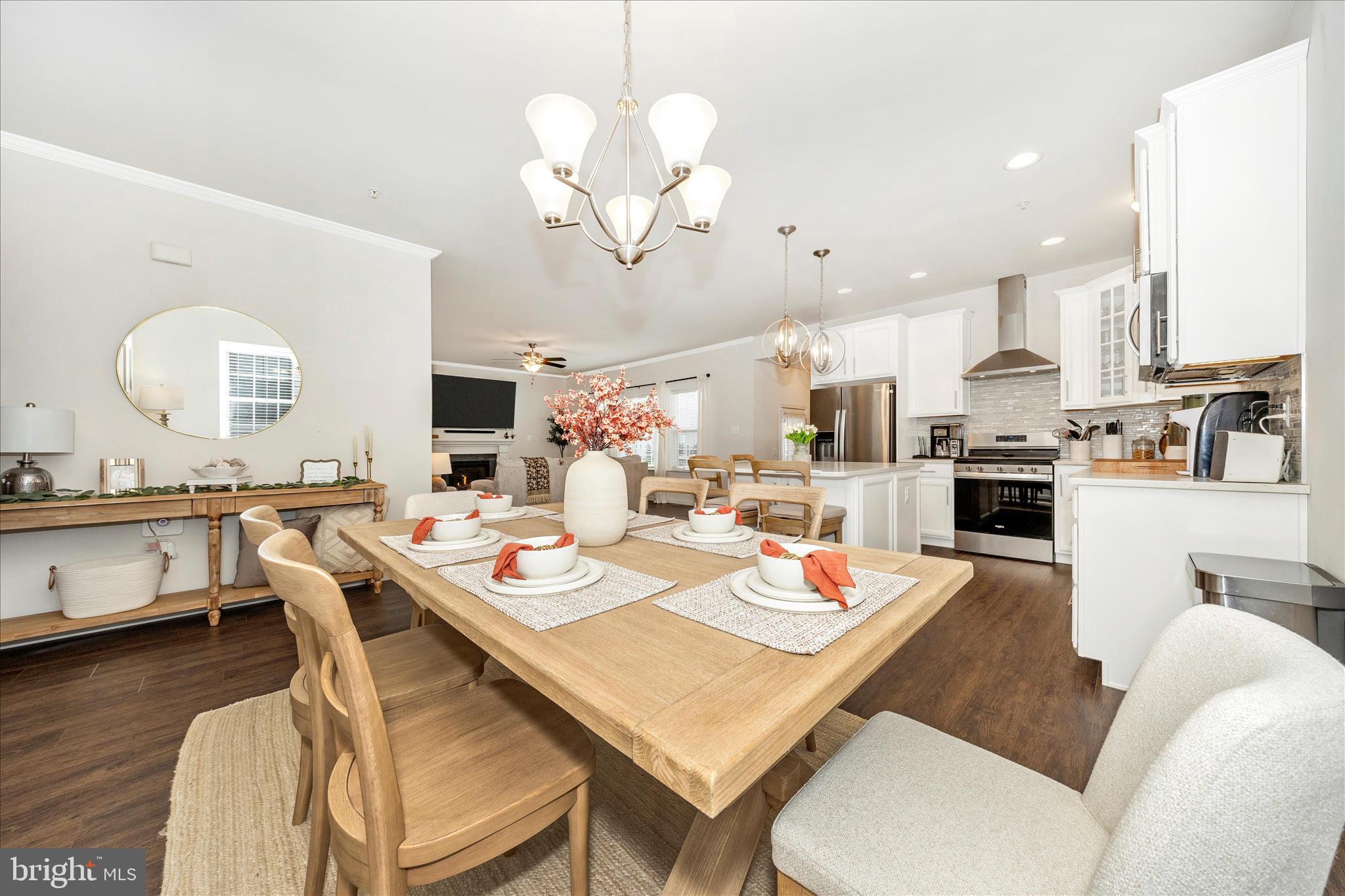 1600 Hobble Trail Frederick, MD 21702 - Photo 48 of 48 a open dining room with wooden floor a chandelier a wooden table and chairs