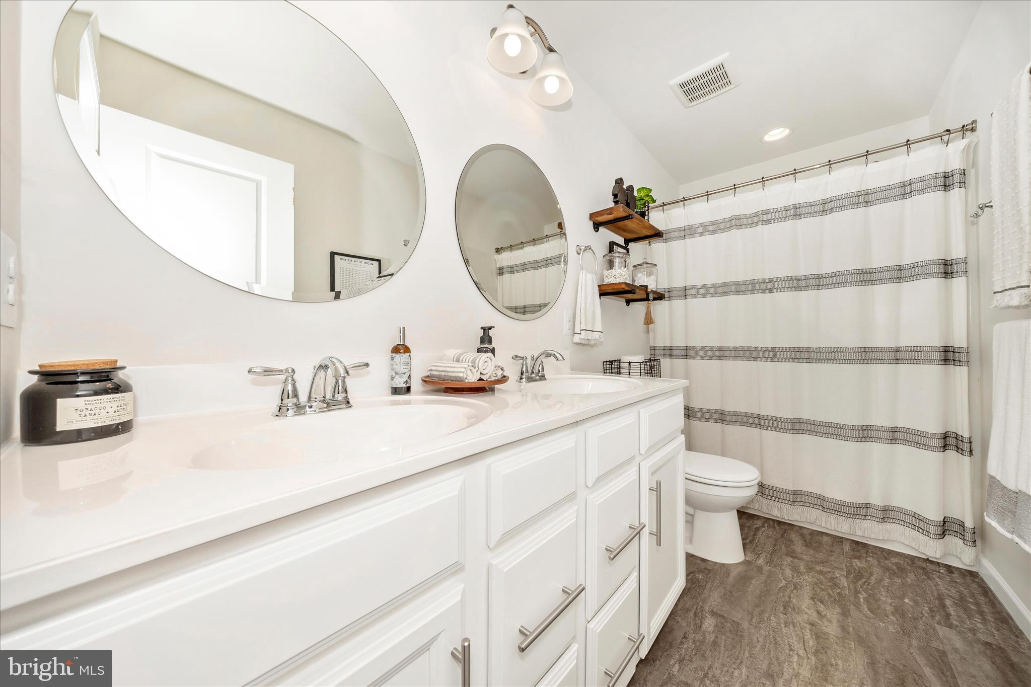 1600 Hobble Trail Frederick, MD 21702 - Photo 28 of 48 a bathroom with a sink a toilet and a mirror