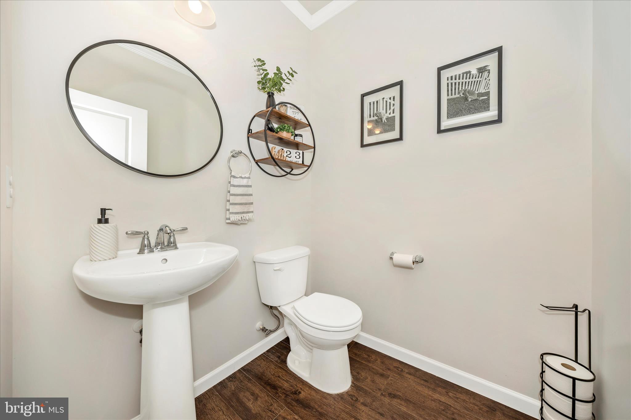 1600 Hobble Trail Frederick, MD 21702 - Photo 7 of 48 a bathroom with a toilet sink and mirror