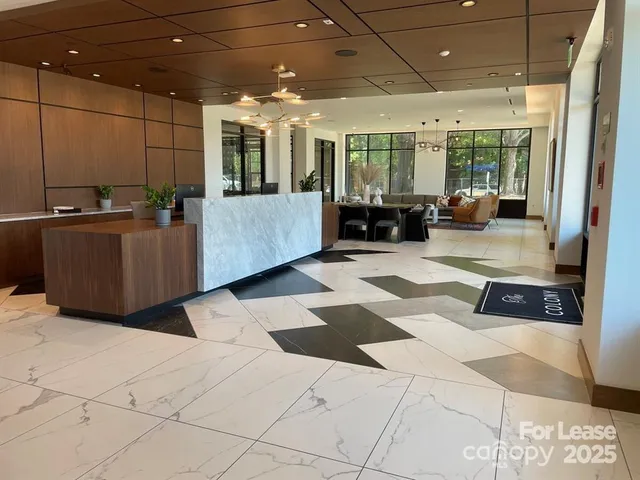 a living room with furniture and flat screen tv