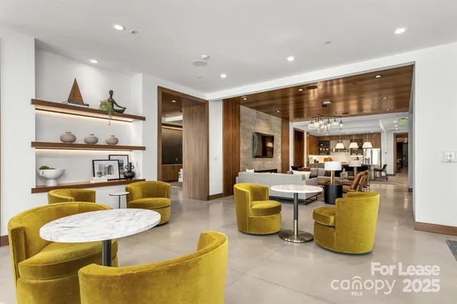 a view of living room with furniture and large window