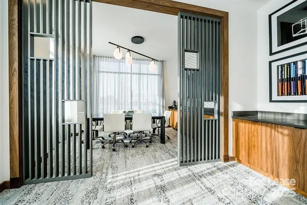 a dining room with furniture and window