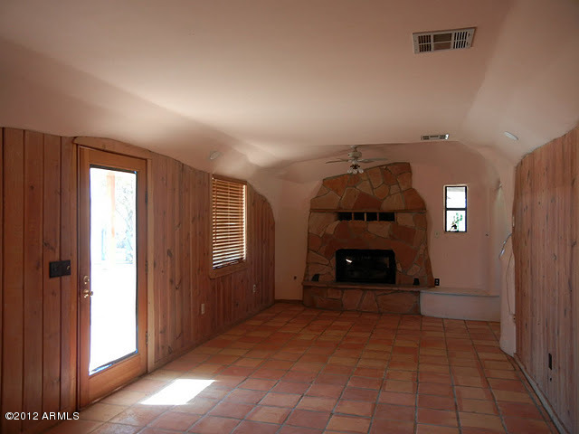 47421 North New River Road New River, AZ 85087 - Photo 5 of 23 an empty room with windows and fireplace