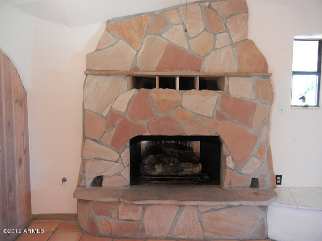 47421 North New River Road New River, AZ 85087 - Photo 6 of 23 a living room with furniture and a fireplace