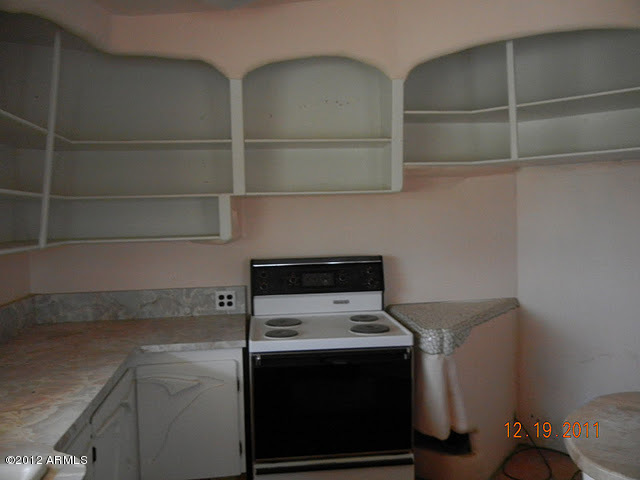 47421 North New River Road New River, AZ 85087 - Photo 8 of 23 a stove top oven sitting inside of a kitchen