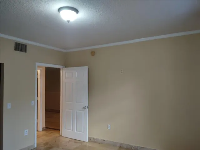 an empty room with closet area