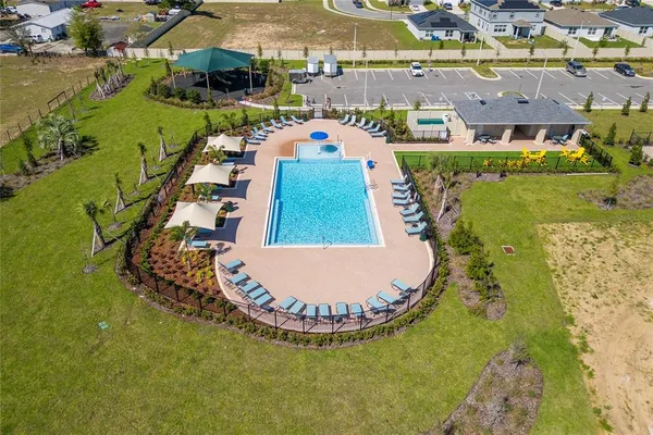 an aerial view of a house with outdoor space lake view