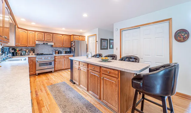 a living room with fireplace furniture and a fireplace