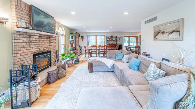 a bedroom with a bed mirror and window
