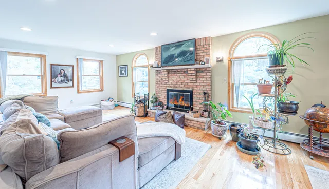 a bedroom with a bed and a fireplace