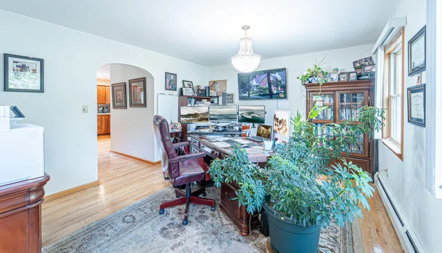 a bathroom with a toilet a sink and shower