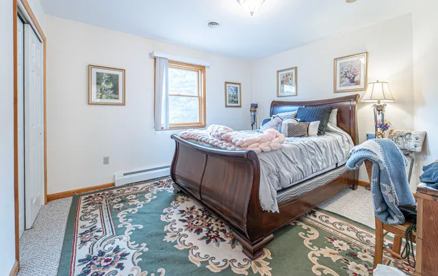 a view of a house with wooden deck and backyard