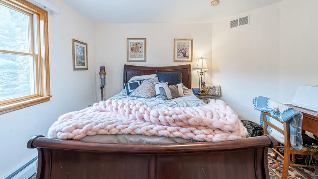 an aerial view of a house with swimming pool and garden