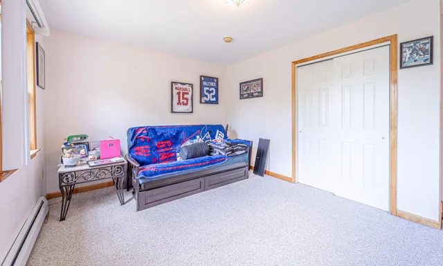 an aerial view of a house with a garden and lake view