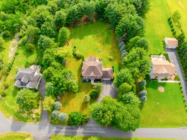 a kitchen with stainless steel appliances kitchen island granite countertop lots of counter top space and a window