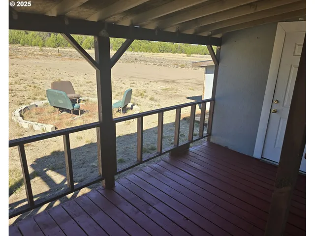 a view of hallway with wooden floor