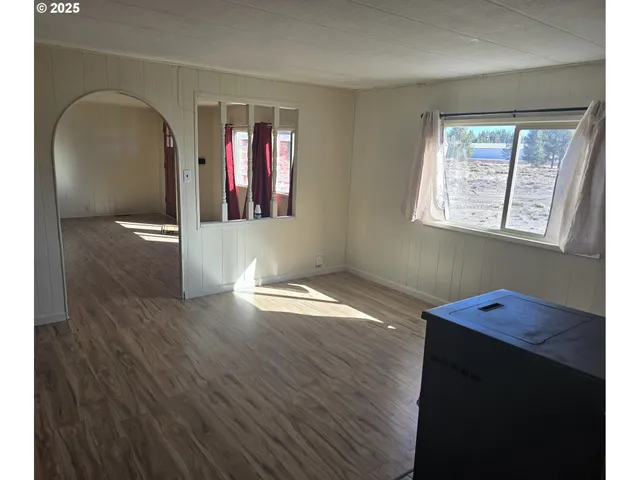 a view of gallery with wooden floor