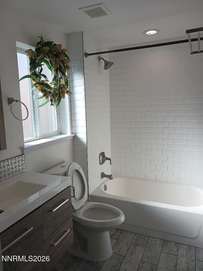 831 Ryland Street Reno, NV 89502 - Photo 10 of 26 a bathroom with a sink a toilet and a bathtub