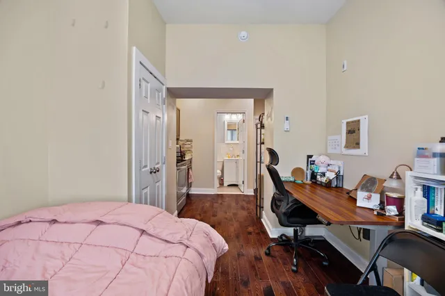 a bedroom with a bed and a table in it