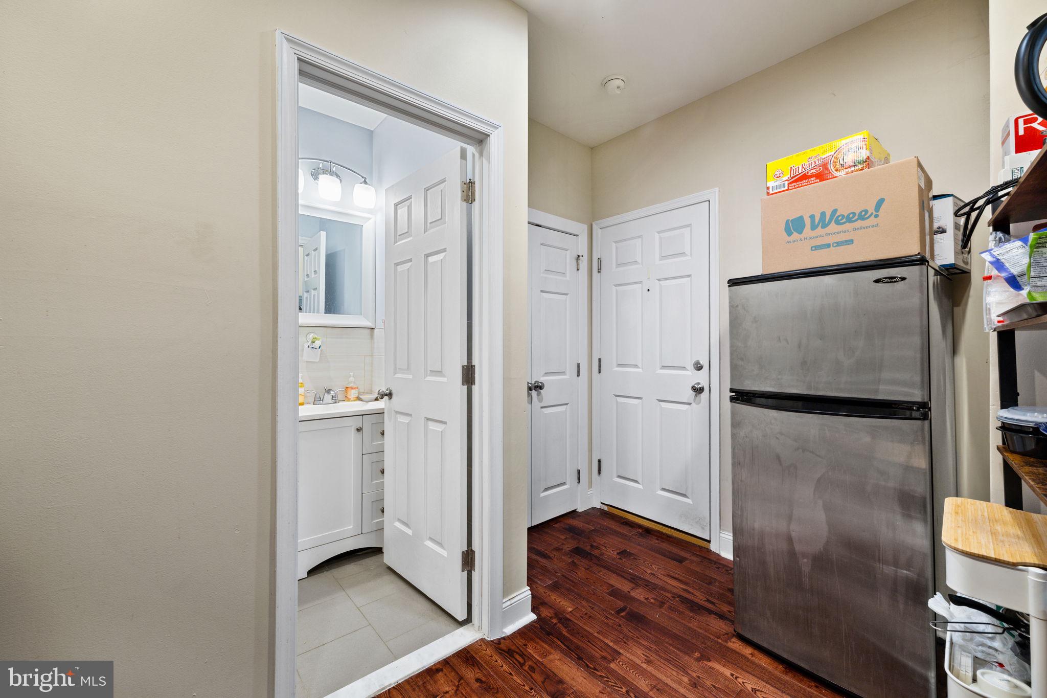 4633 Walnut Street, Unit B Philadelphia, PA 19139 - Photo 7 of 9 a view of walk in closet with wooden floor
