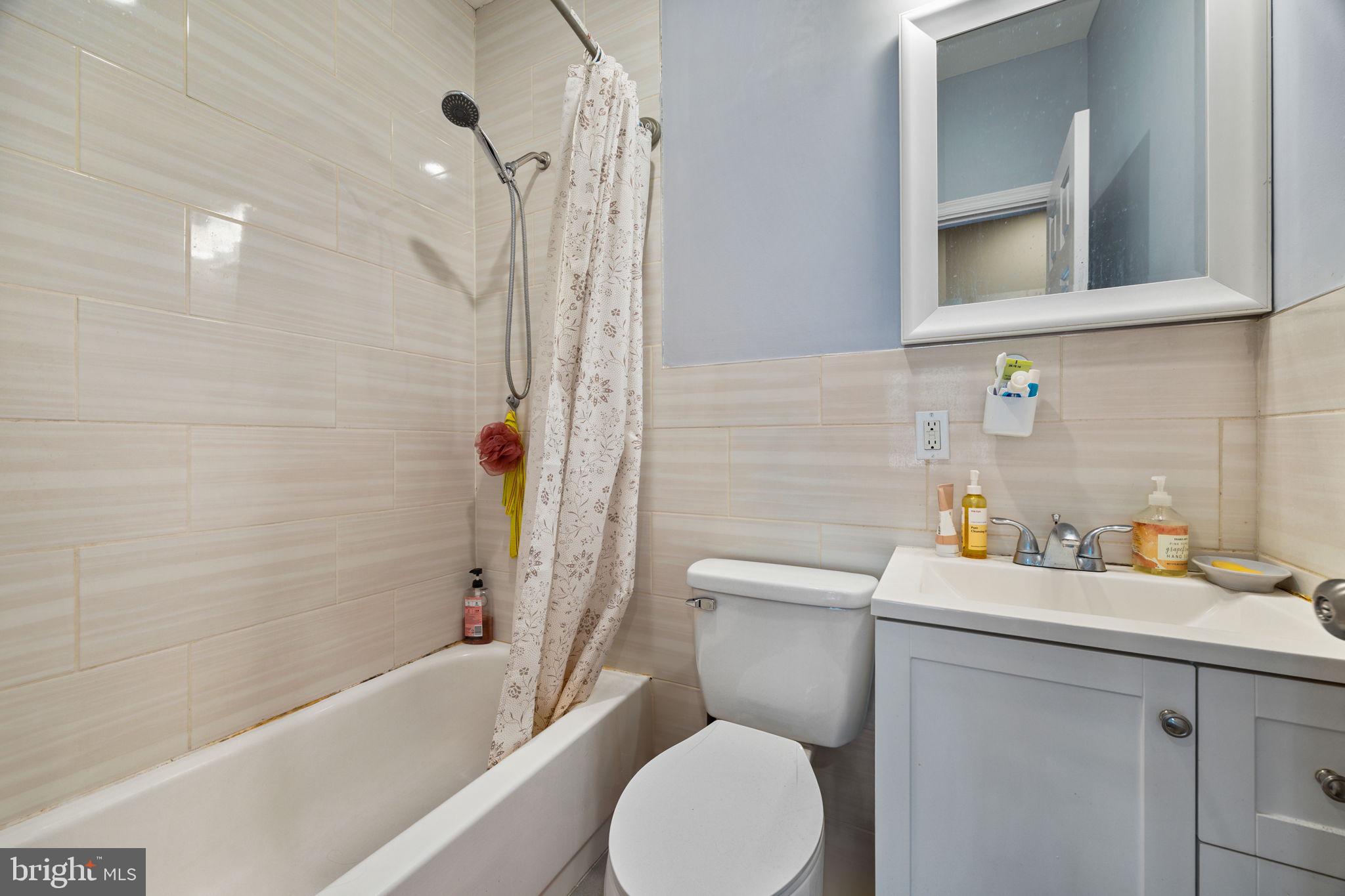 4633 Walnut Street, Unit B Philadelphia, PA 19139 - Photo 8 of 9 a bathroom with a sink toilet and shower