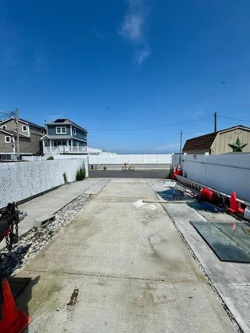 a view of a road with a building in the background