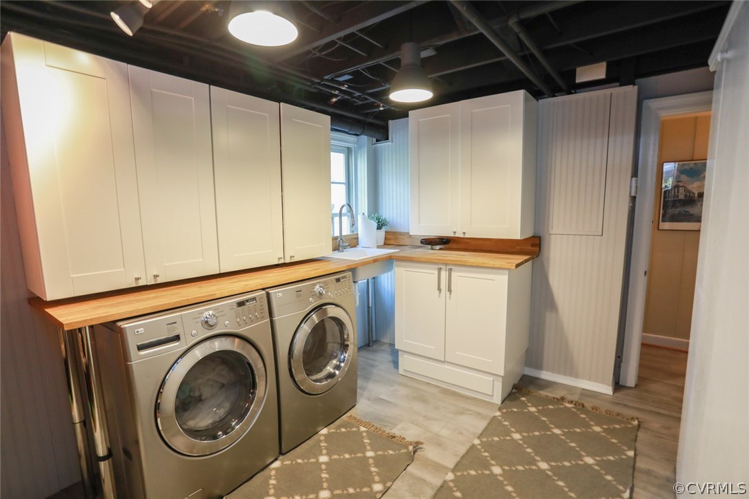 8708 River Road Richmond, VA 23229 - Photo 24 of 43 Laundry/Utility/Mud Room has storage cabinets, 3 c