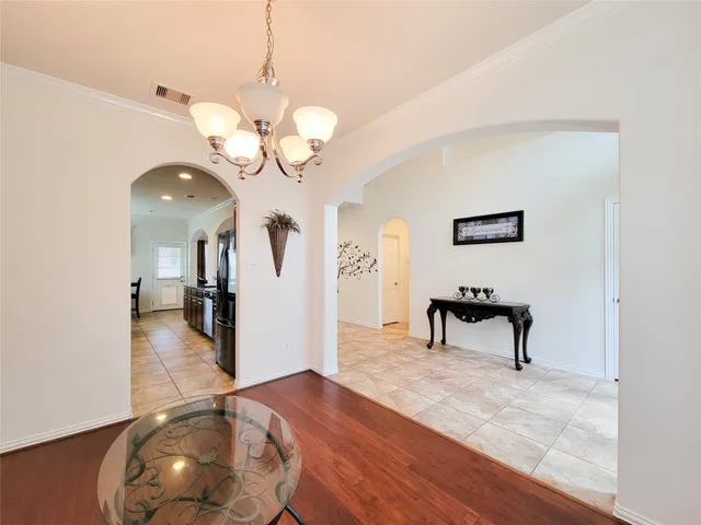 a view of a livingroom with furniture and a wooden floor