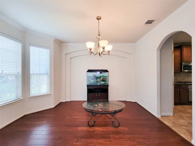 a living room with couch table and a window