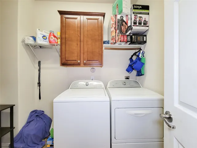 a view of a patio with a table and chairs