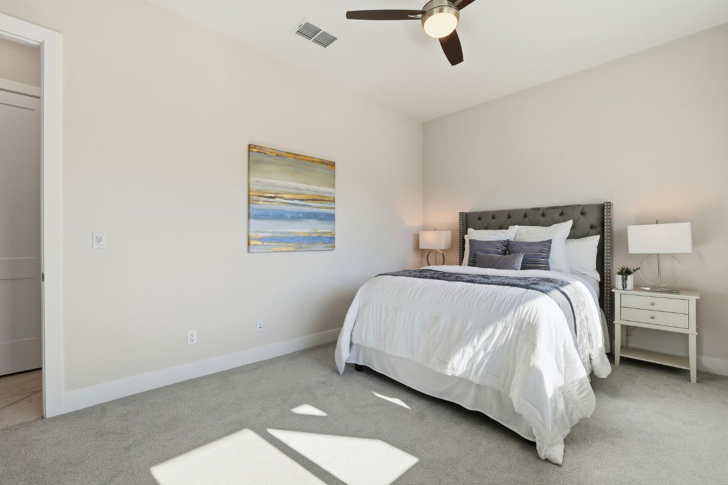 2121 Arbor Rdg Drive Roseville, CA 95747 - Photo 11 of 83 a bedroom with a bed and painting on the wall